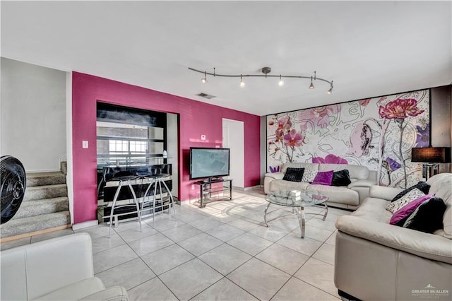 2201 S Jackson Road I Unit 7, Pharr, TX 78577 - tiled living room with track lighting, stairway, and baseboards