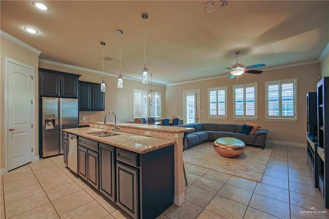 kitchen with visible vents, ornamental molding, a sink, and appliances with stainless steel finishes