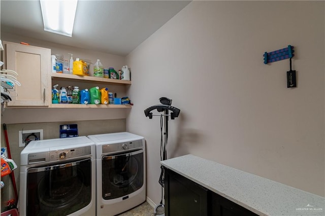 laundry area featuring cabinet space and washing machine and clothes dryer