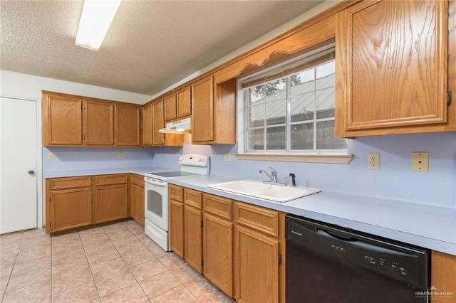 2109 E 28th St, Mission, TX 78574 - kitchen with white electric range oven, light countertops, a sink, under cabinet range hood, and dishwasher
