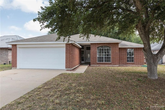 2109 E 28th St, Mission, TX 78574 - single story home featuring driveway, brick siding, an attached garage, and a front yard