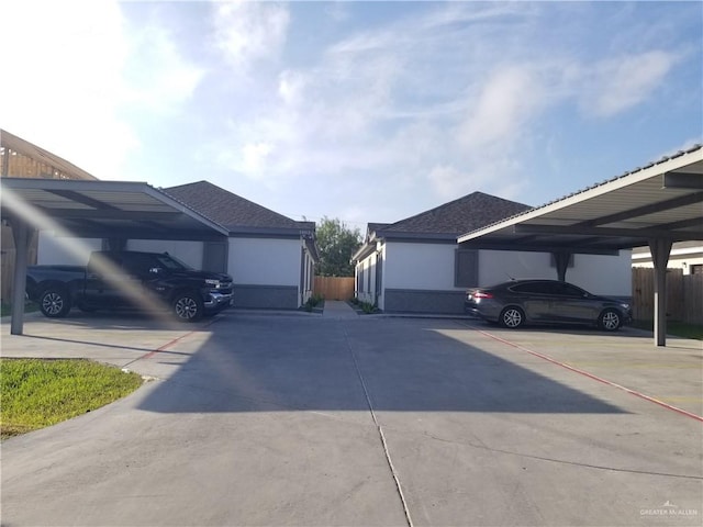 view of side of home with a carport