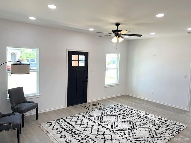 entryway with hardwood / wood-style flooring and ceiling fan