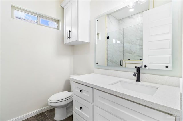 bathroom with tile patterned flooring, vanity, toilet, and walk in shower