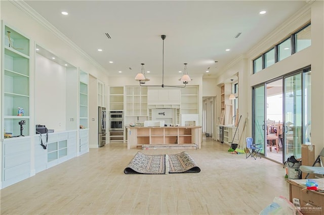 kitchen with ornamental molding, recessed lighting, and light wood-style flooring