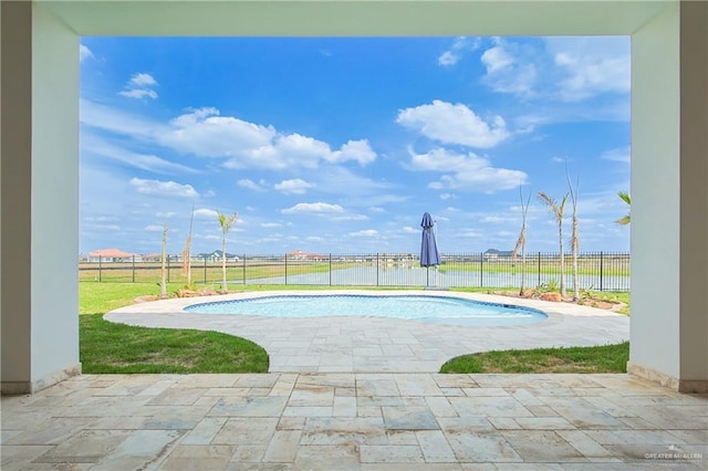 view of pool with a yard, a fenced backyard, a fenced in pool, and a patio