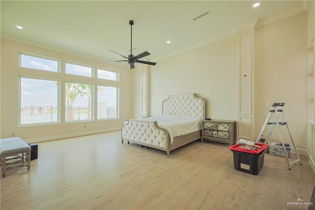 bedroom featuring recessed lighting, wood finished floors, visible vents, baseboards, and ornamental molding