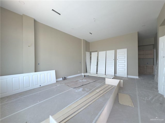 spare room with concrete flooring