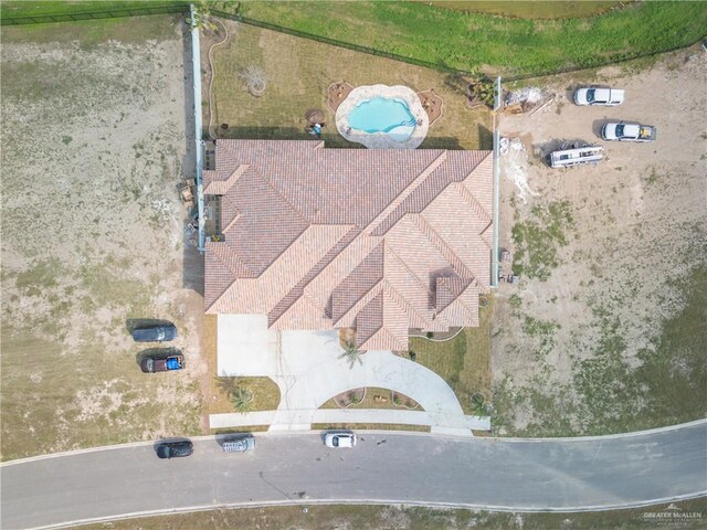 rear view of property featuring a lawn, a water view, and a patio