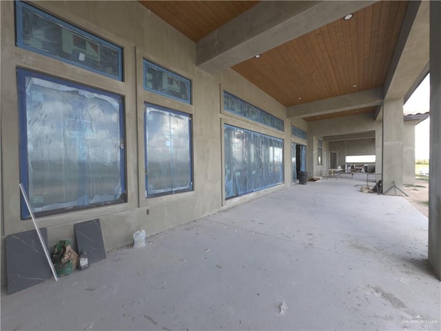 interior space with beam ceiling and wood ceiling