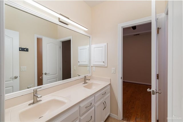 bathroom with hardwood / wood-style floors and vanity