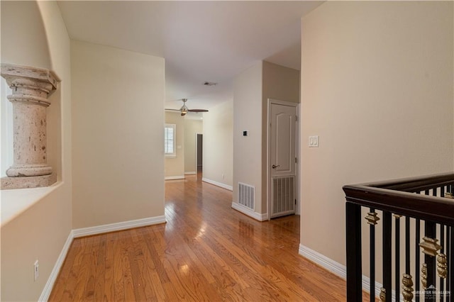 hall with light hardwood / wood-style floors