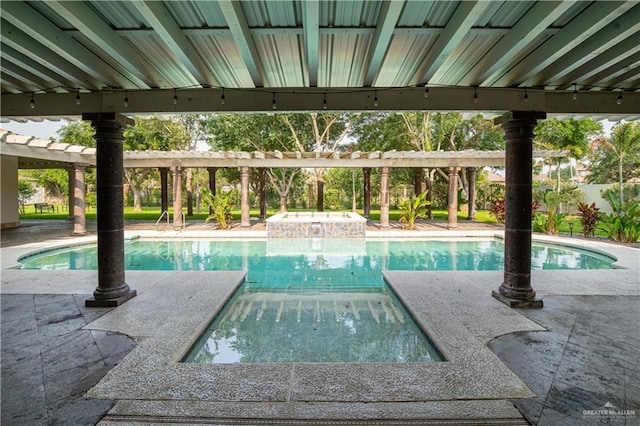 view of swimming pool featuring an in ground hot tub