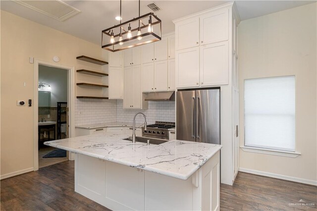 kitchen with dark hardwood / wood-style flooring, a kitchen island with sink, sink, high quality appliances, and white cabinets