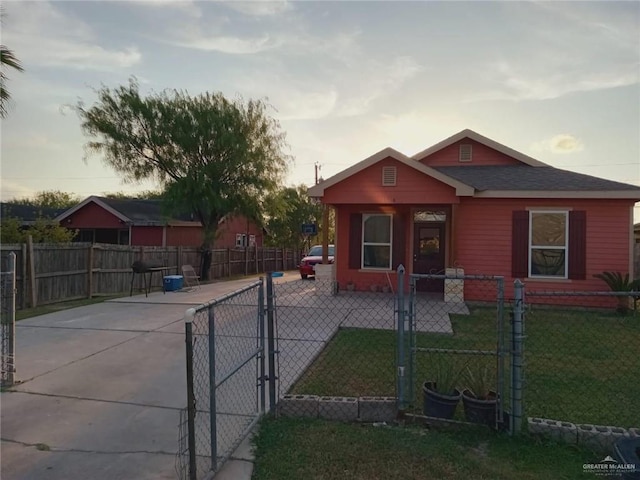 bungalow-style home with a yard