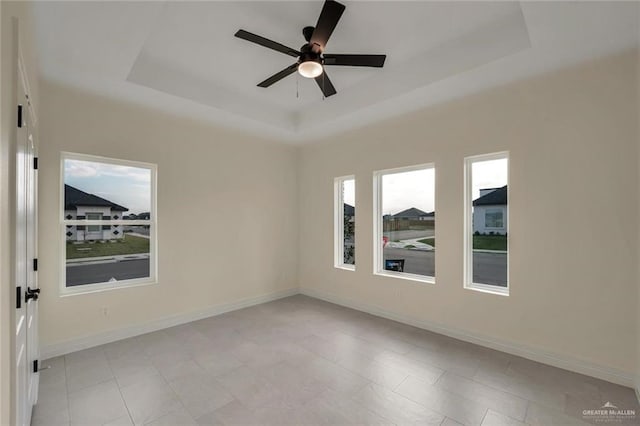 4012 Burr Dr, Edinburg, TX 78542 - empty room with a raised ceiling and a ceiling fan