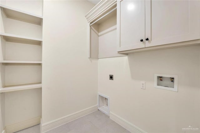 4012 Burr Dr, Edinburg, TX 78542 - laundry room featuring hookup for an electric dryer, hookup for a washing machine, light tile patterned floors, and cabinet space