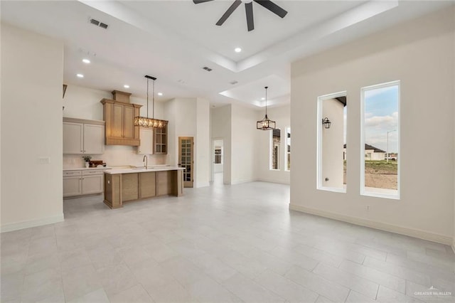 4012 Burr Dr, Edinburg, TX 78542 - kitchen with open floor plan, a ceiling fan, recessed lighting, light countertops, and a center island with sink