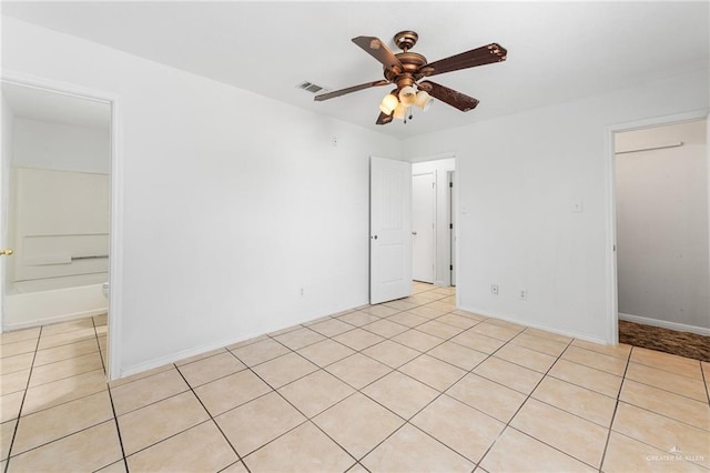 8907 Other, San Antonio, TX 78242 - empty room featuring ceiling fan, light tile patterned floors, and baseboards
