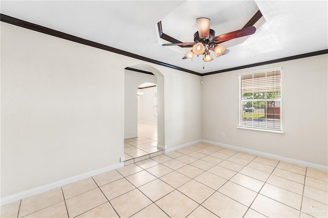 8907 Other, San Antonio, TX 78242 - spare room featuring arched walkways, ceiling fan, ornamental molding, baseboards, and light tile patterned floors
