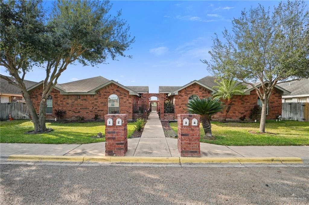 ranch-style house featuring a front lawn