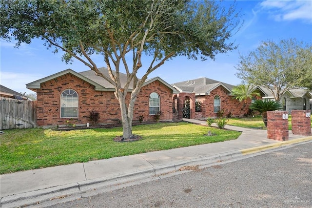 ranch-style house featuring a front lawn