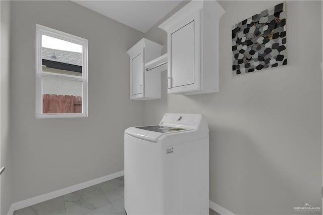 laundry area featuring cabinets and washer / clothes dryer