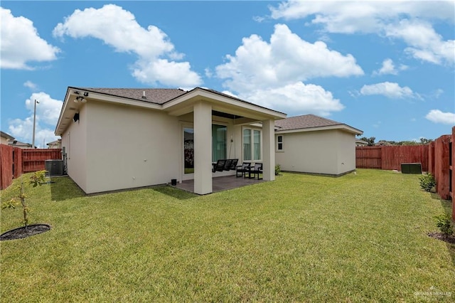 rear view of house featuring central air condition unit, a patio area, and a lawn