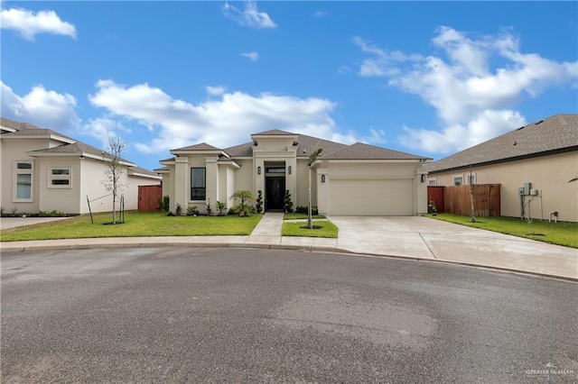 view of front facade with a garage and a front yard