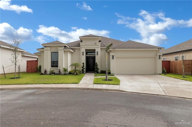 view of front facade featuring a garage and a front yard