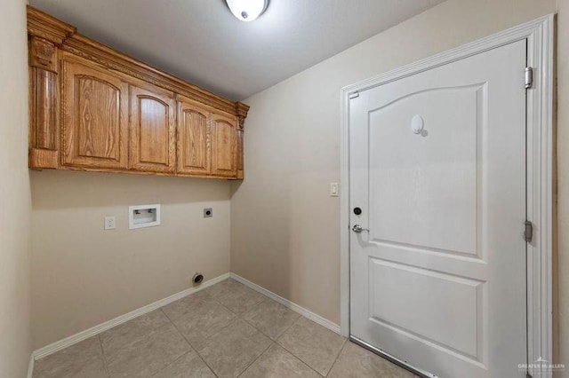 laundry room featuring light tile patterned flooring, cabinets, washer hookup, and hookup for an electric dryer