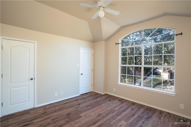 unfurnished room featuring ceiling fan, dark wood-type flooring, and vaulted ceiling