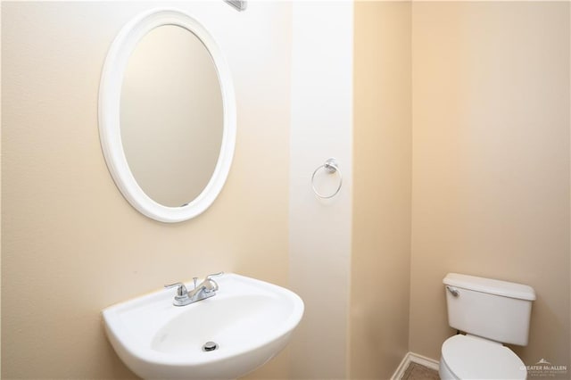 bathroom featuring sink and toilet