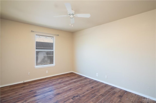 empty room with dark hardwood / wood-style floors and ceiling fan