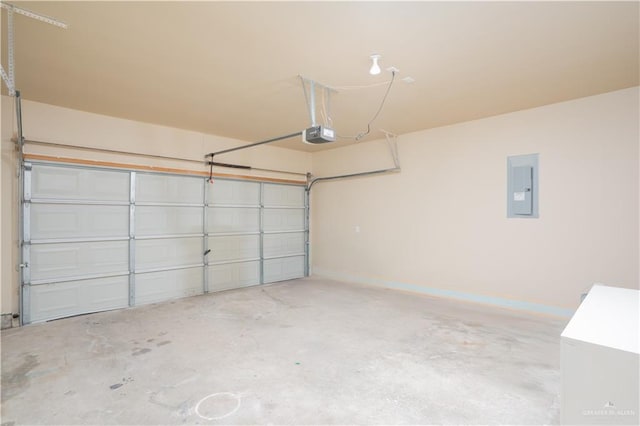 garage with electric panel and a garage door opener