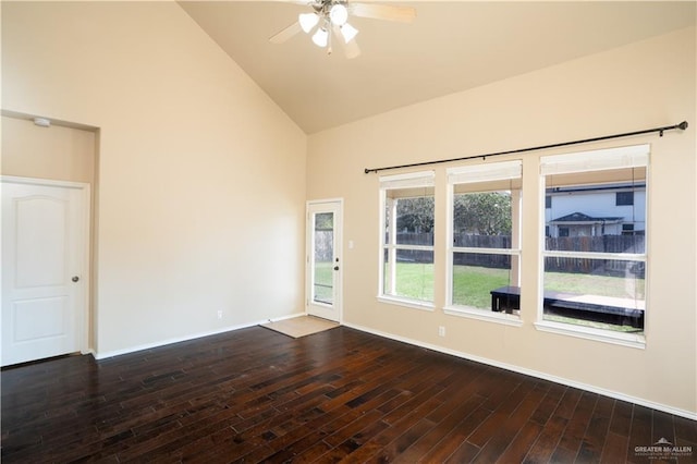 empty room with ceiling fan, dark wood-type flooring, and high vaulted ceiling