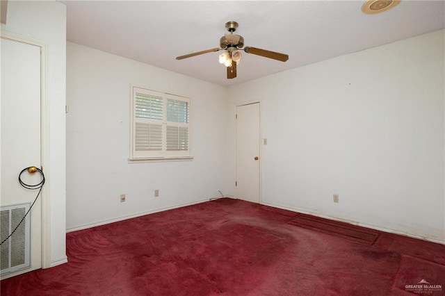 empty room featuring carpet floors and ceiling fan