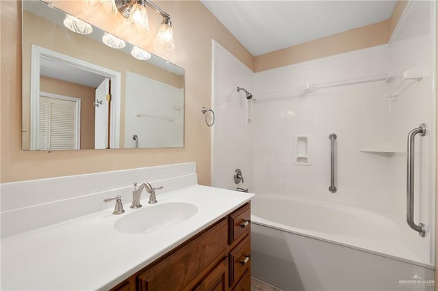 bathroom with vanity and shower / washtub combination