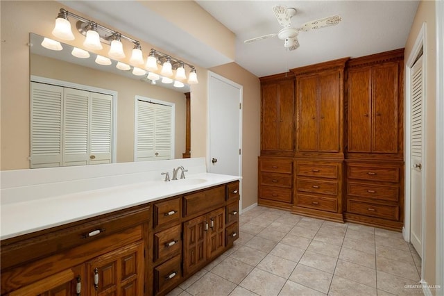 bathroom with ceiling fan, vanity, and tile patterned flooring