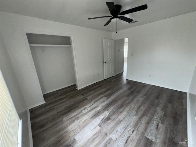 2504-2606 N M Rd, Edinburg, TX 78542 - unfurnished bedroom with dark wood-type flooring, a closet, and a ceiling fan