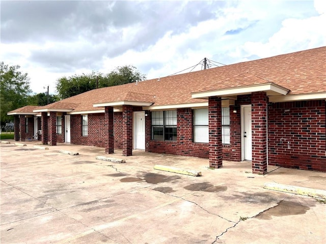 2504-2606 N M Rd, Edinburg, TX 78542 - ranch-style house featuring roof with shingles and brick siding