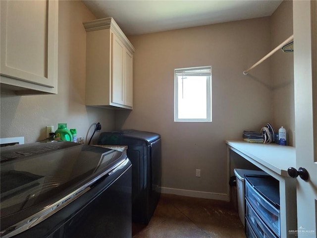16637 W Barnes Ct, Harlingen, TX 78552 - washroom featuring cabinet space, washer and dryer, baseboards, and dark tile patterned floors
