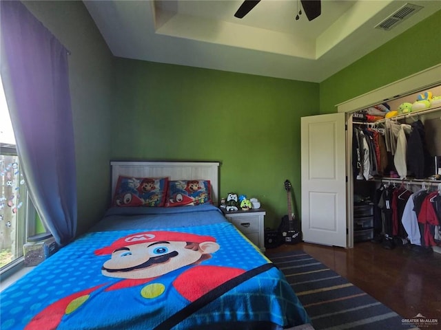 16637 W Barnes Ct, Harlingen, TX 78552 - bedroom with multiple windows, a tray ceiling, and a closet