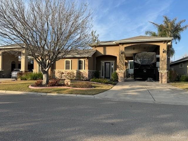 view of front of property featuring a carport