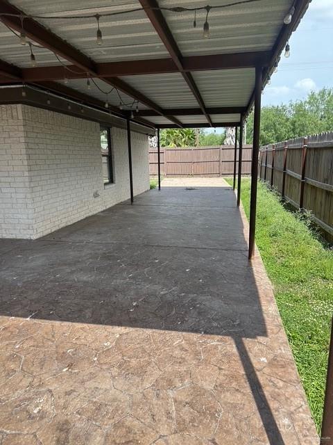 1502 W Kennedy Ave, Alton, TX 78573 - view of car parking featuring a fenced backyard and a carport