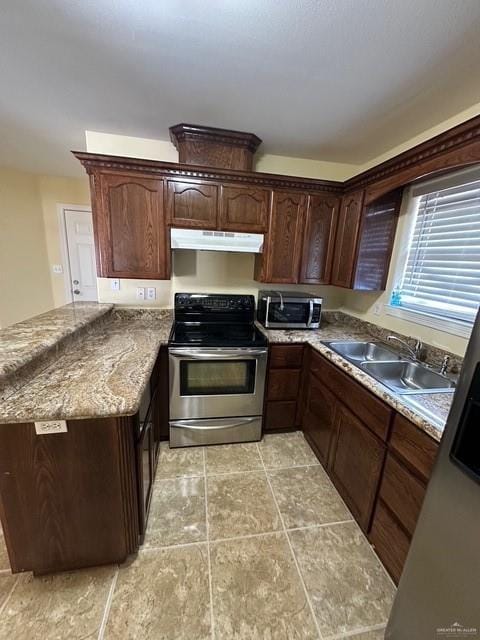 1502 W Kennedy Ave, Alton, TX 78573 - kitchen featuring stainless steel appliances, under cabinet range hood, a sink, a peninsula, and light tile patterned floors