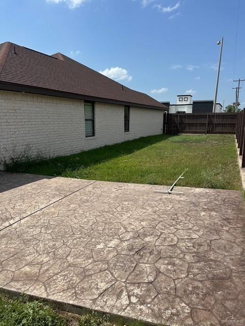 1502 W Kennedy Ave, Alton, TX 78573 - view of yard featuring a patio