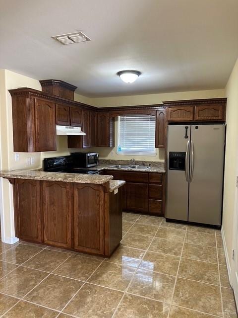 1502 W Kennedy Ave, Alton, TX 78573 - kitchen featuring stainless steel refrigerator with ice dispenser, under cabinet range hood, a peninsula, a sink, and range