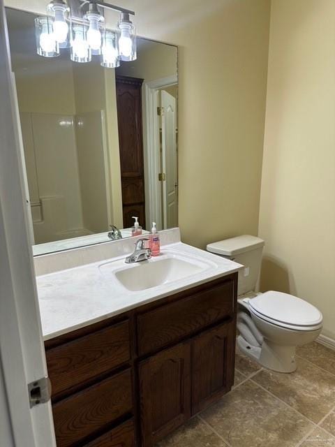 1502 W Kennedy Ave, Alton, TX 78573 - full bathroom with toilet, vanity, and tile patterned floors