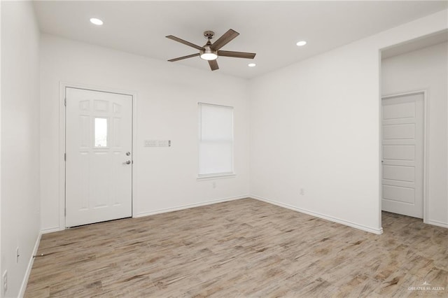 foyer featuring ceiling fan and light wood-type flooring